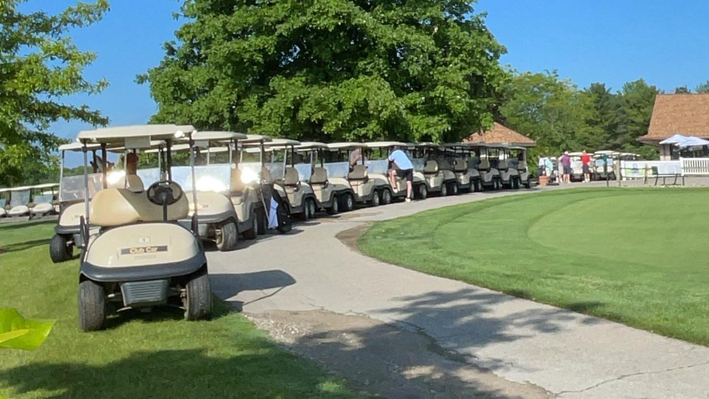 Row of golf carts ready for tournament