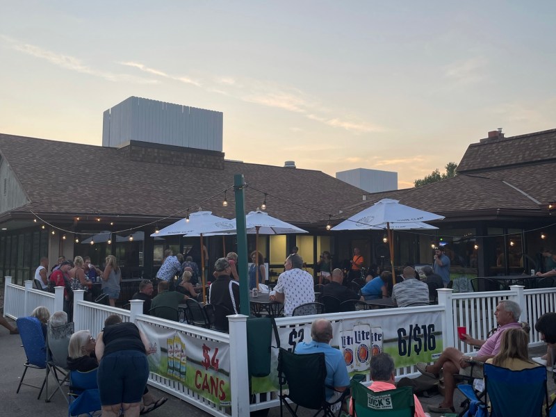 view of patio filled with people